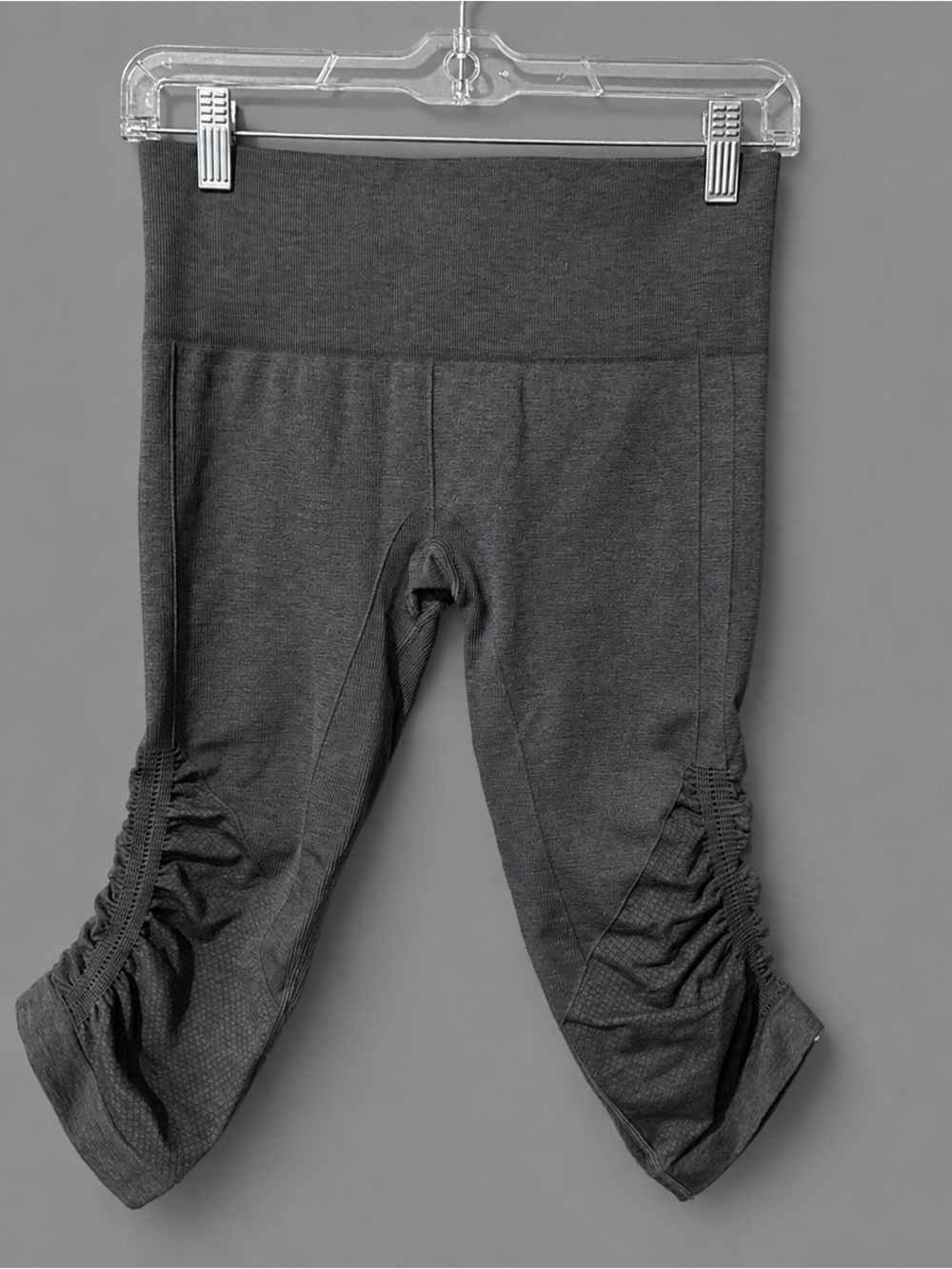 These are Lululemon In The Flow Crop leggings in a dark grey